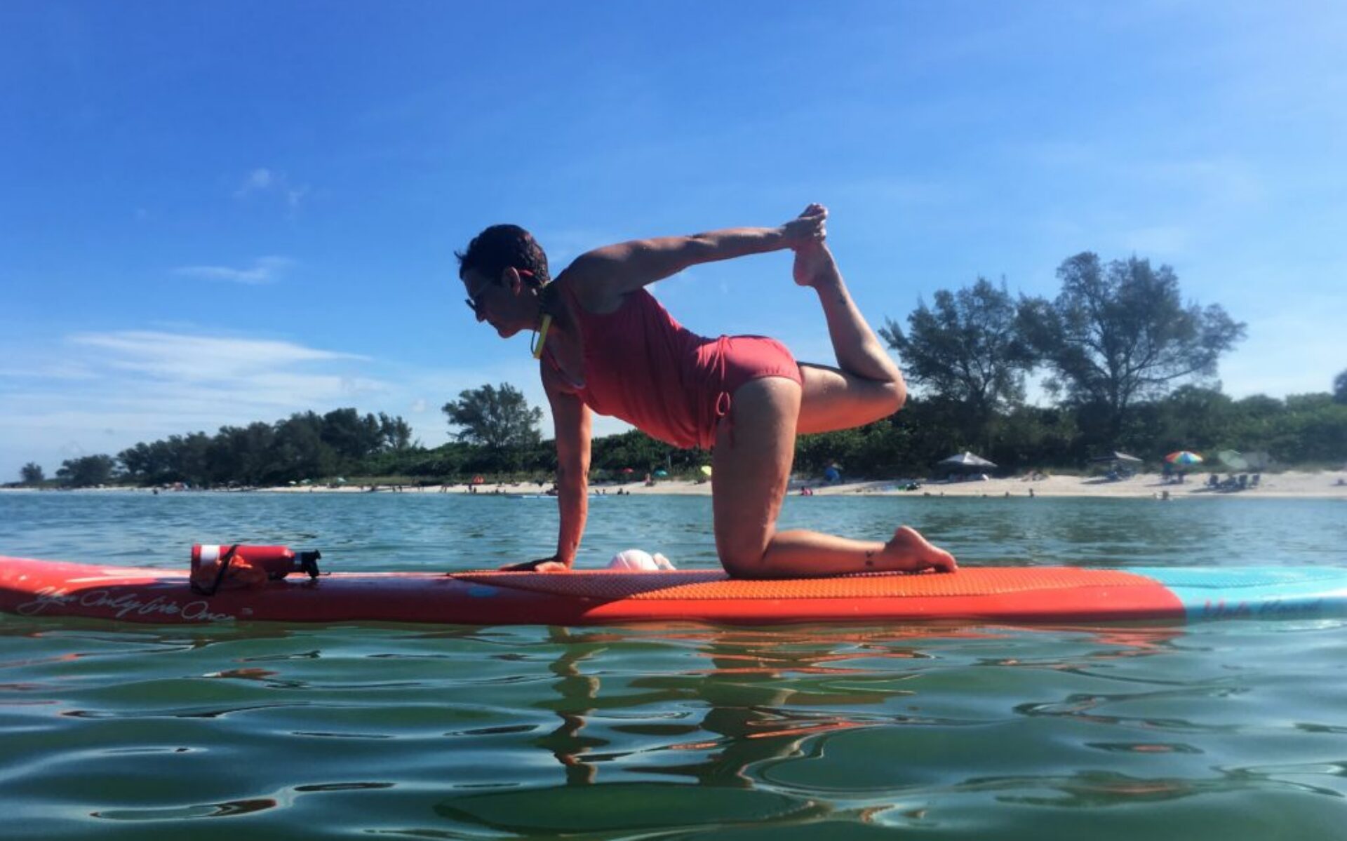 SUP Yoga Instructor and Yoga teacher Jodi on paddle board